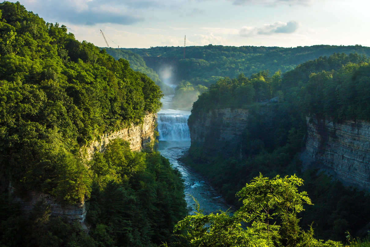 Sunlight lights up the gorge in Letchworth State Park with kids in New York State
