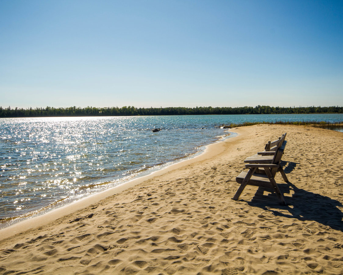 Benches on the beach at Misery Bay Provincial Park on Manitoulin Island. Hiking Misery Bay Provincial Park is one of the best things to do on Manitoulin Island