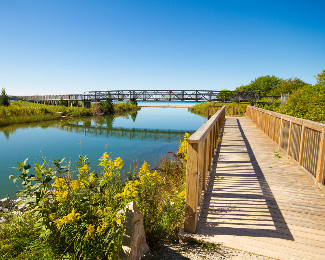 Boardwalk in Providence Bay Manitoulin Island. A walk along the boardwalk and beach in Providence Bay is one of the most amazing things to do on Manitoulin Island