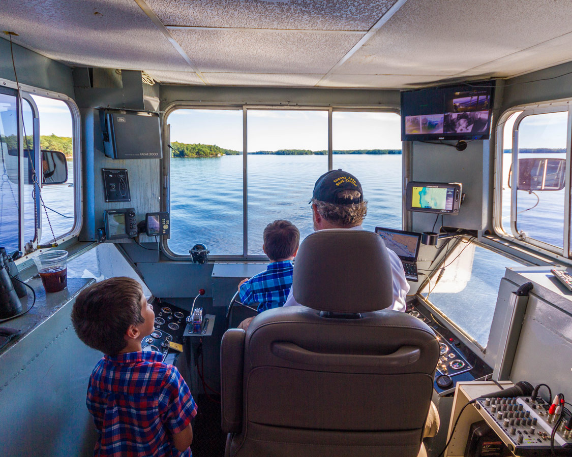 Boys check out the bridge of the Lady Muskoka cruise in Bracebridge Ontario