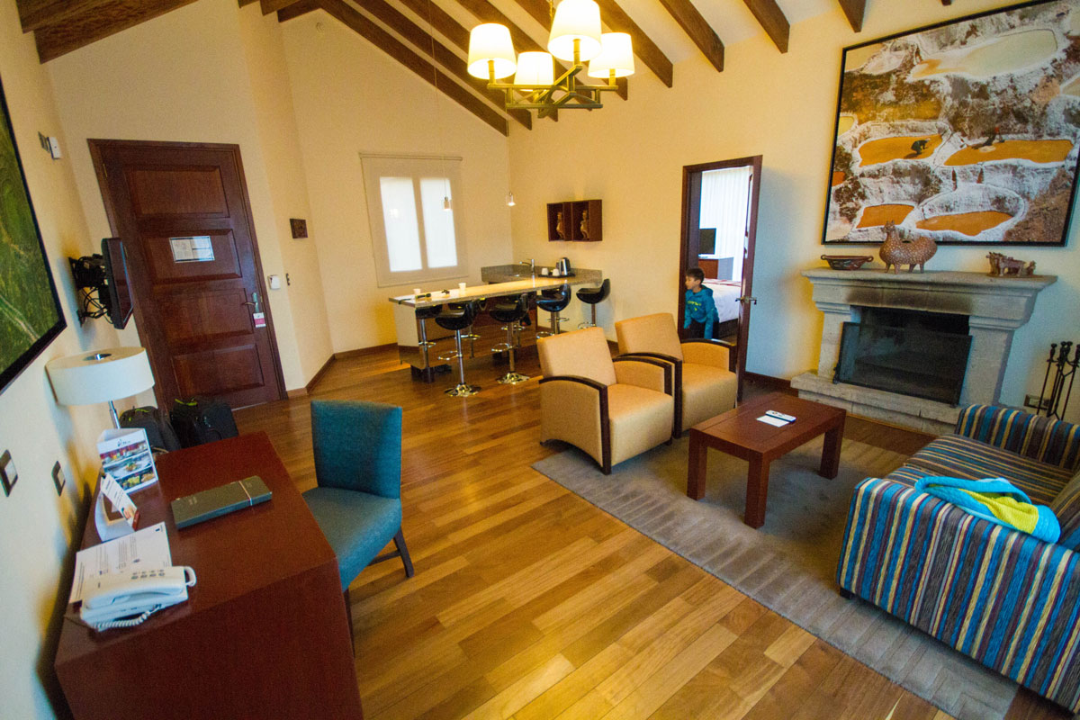 Living room of a chalet at the Casa Andina Private Collection Sacred Valley Peru with kids is where we stayed during our two weeks in Peru