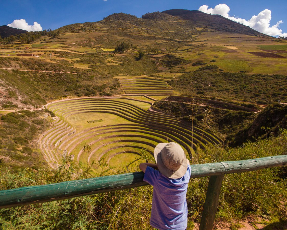 Looking out over the agricultural terraces of Moray Peru with kids in the Sacred Valley on a 14 day Peru Itinerary