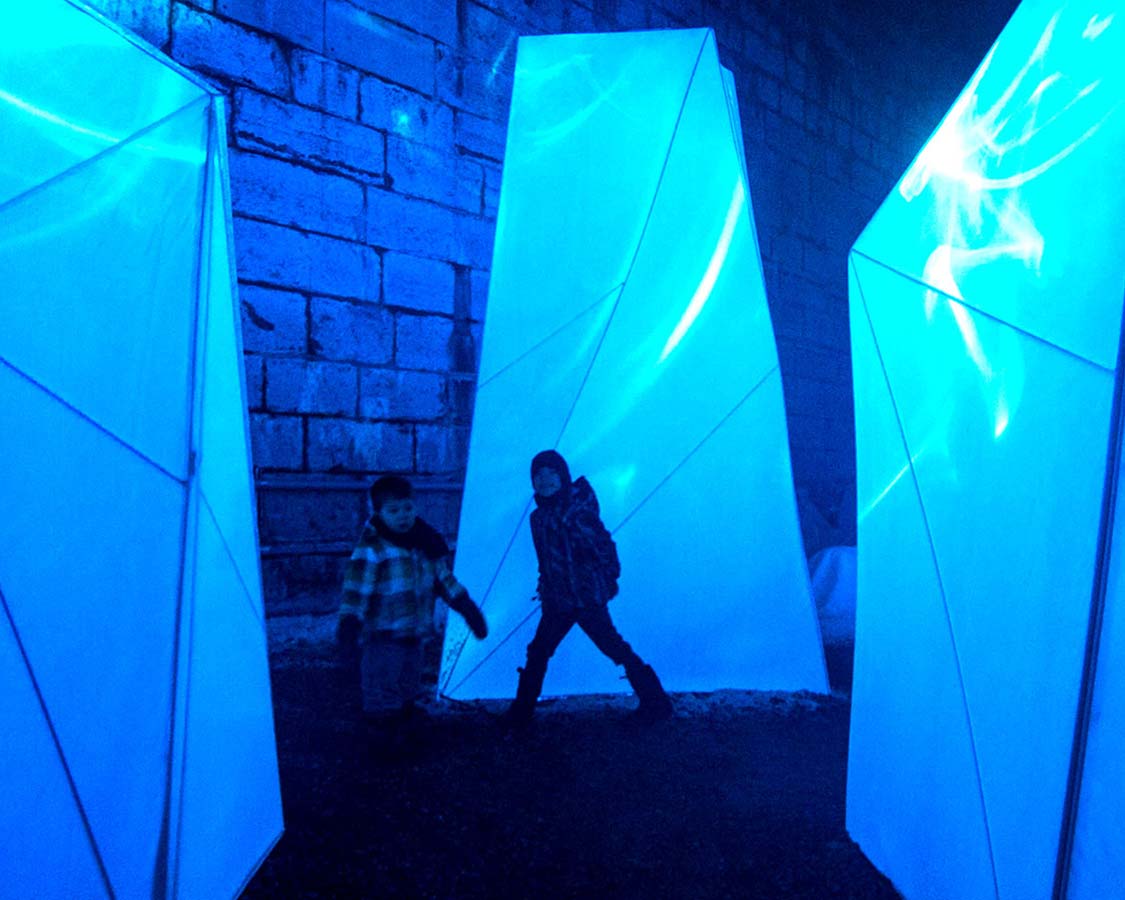 We visit Lumina Borealis with kids at historic Fort Henry in Kingston, Ontario. This interactive lighting exhibit makes for a perfect winter family outing.