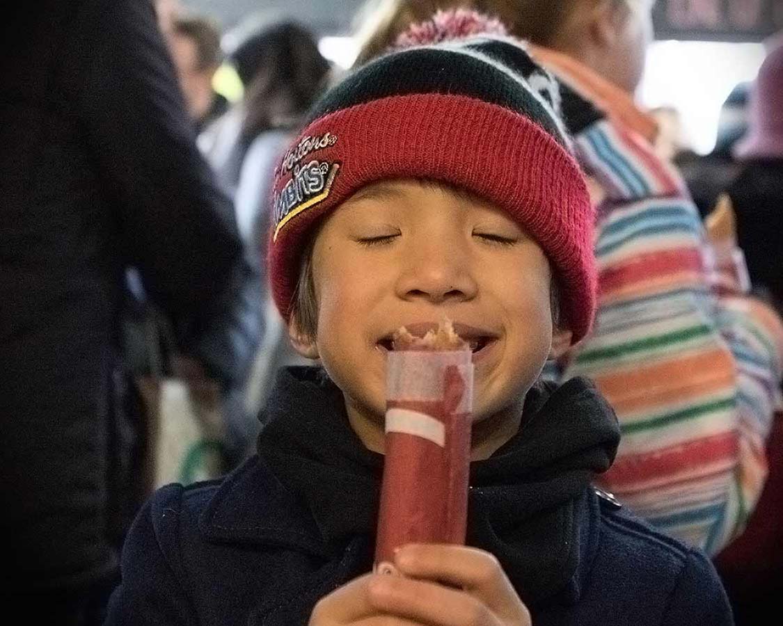 Smiling at eating Pancho's Churros on a Tasty Tour of Toronto's Kensington Market