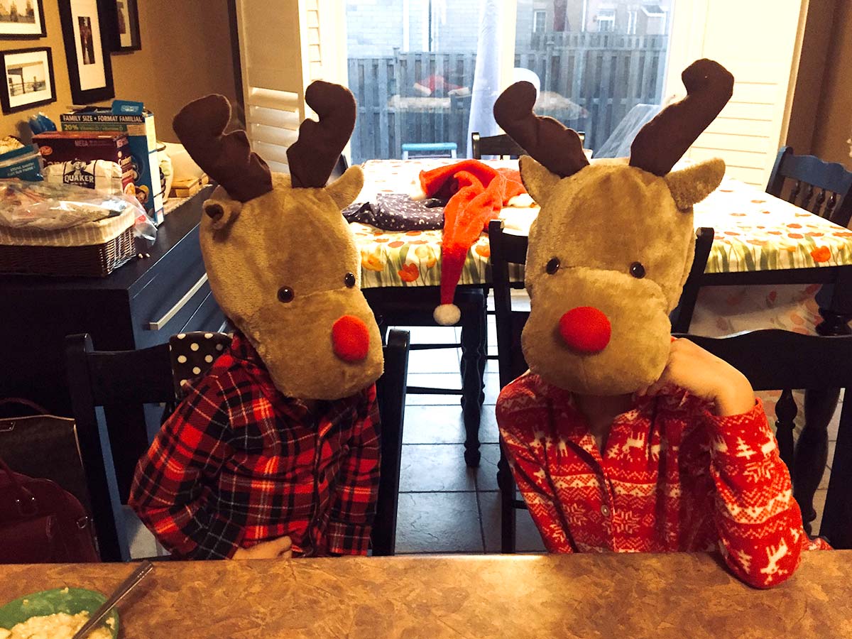 Kids in Reindeer hats at home