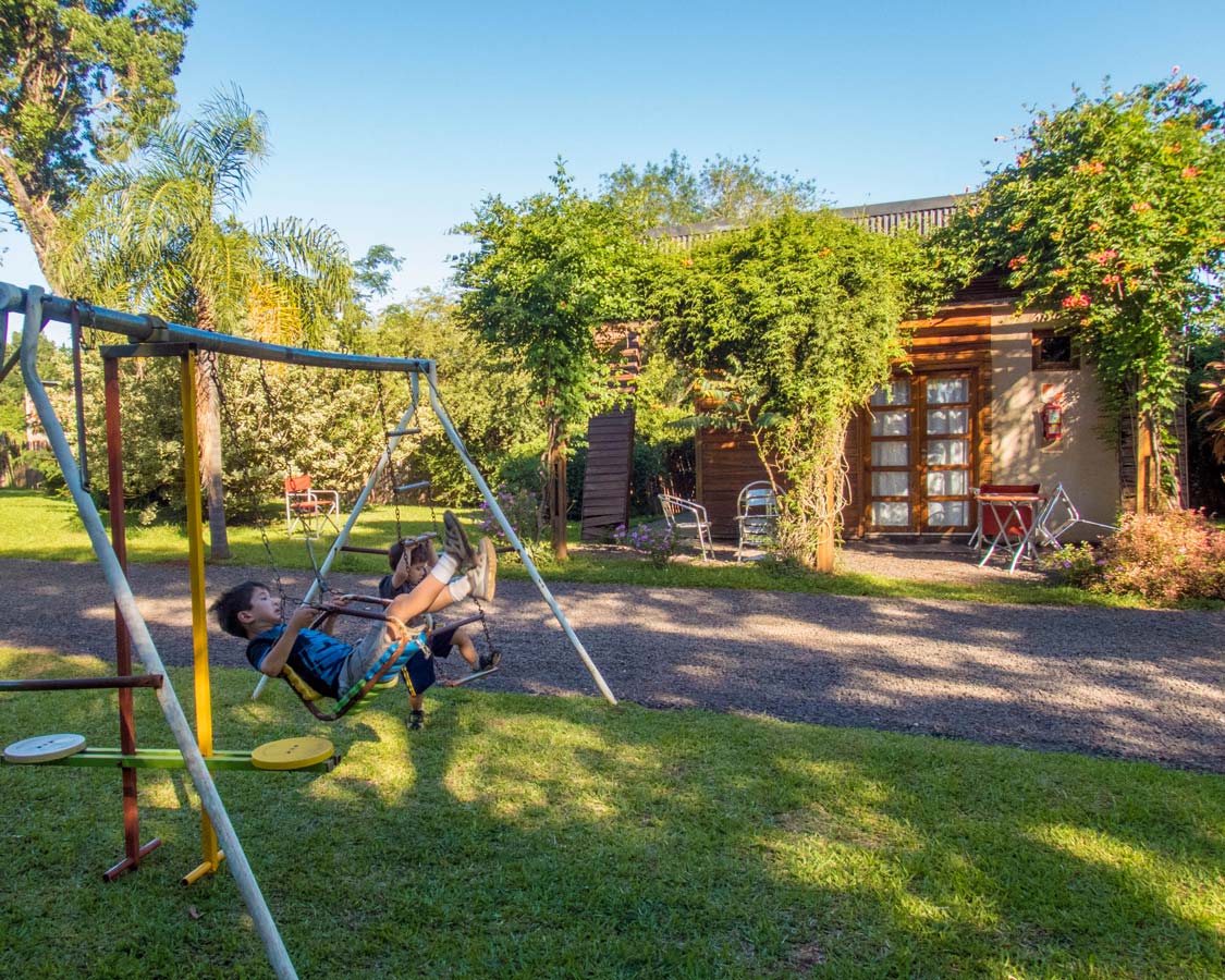 Children play on a swingset at Brizas del Norte hotel in San Ignacio Argentina