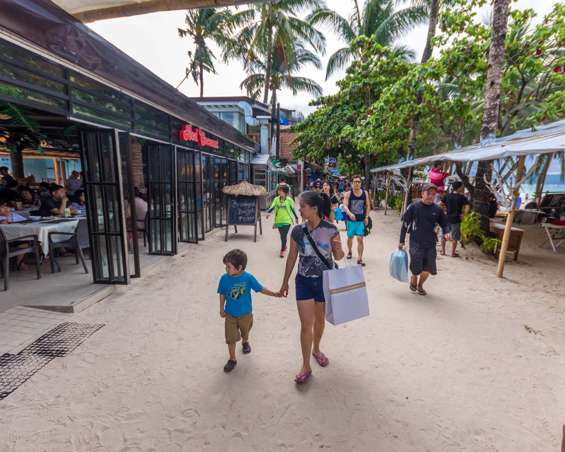 Shopping-atA woman and young son shopt at DMall in Boracay Philippines Station 2