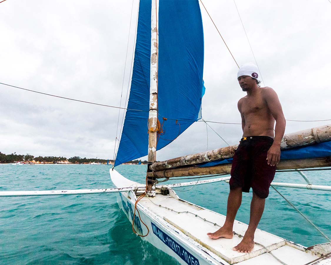 A paraw boat captain sailing in Boracay Philippines