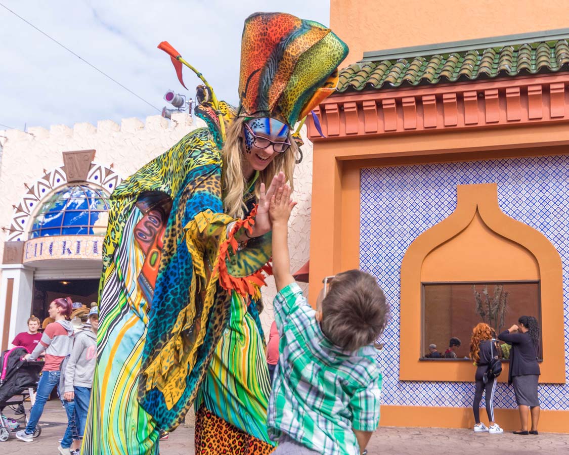 A young boy greets a performer at Busch Gardens Tampa Bay Florida with kids