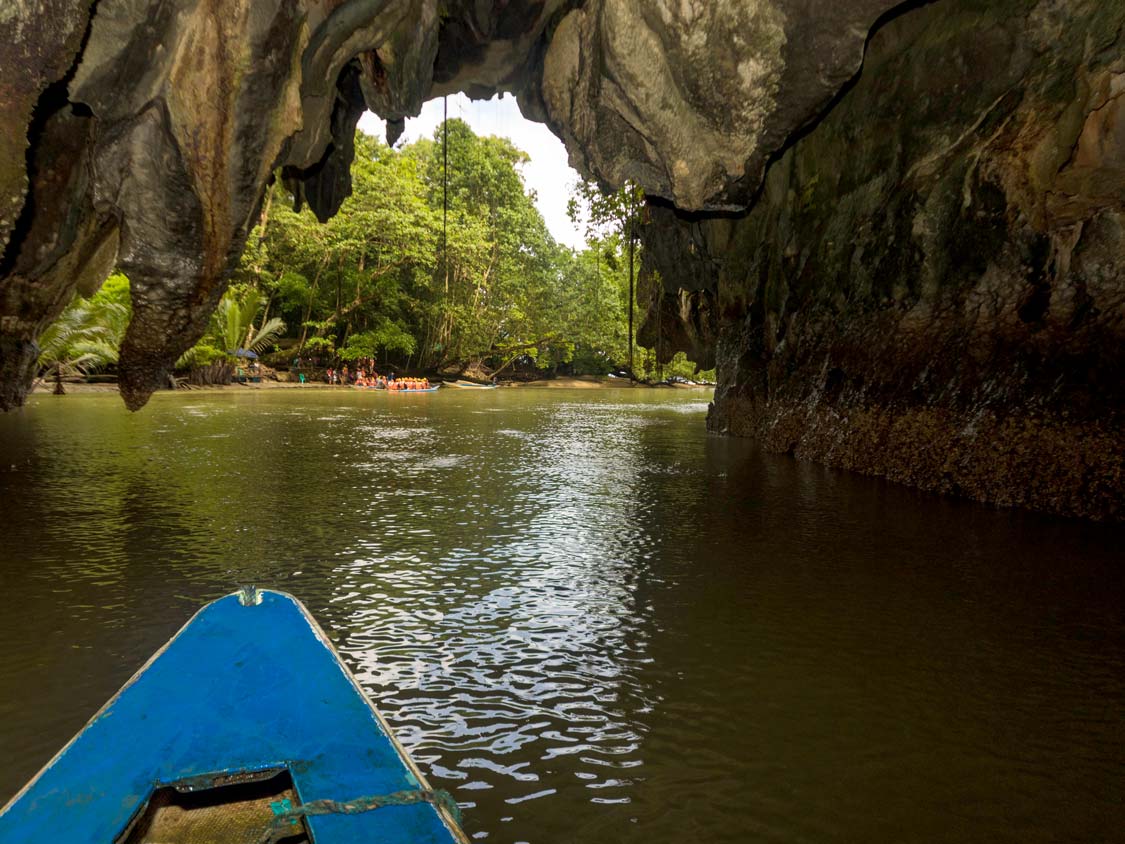 Boat leaving a cave at the Philippines Underground River in Puerto Princesa
