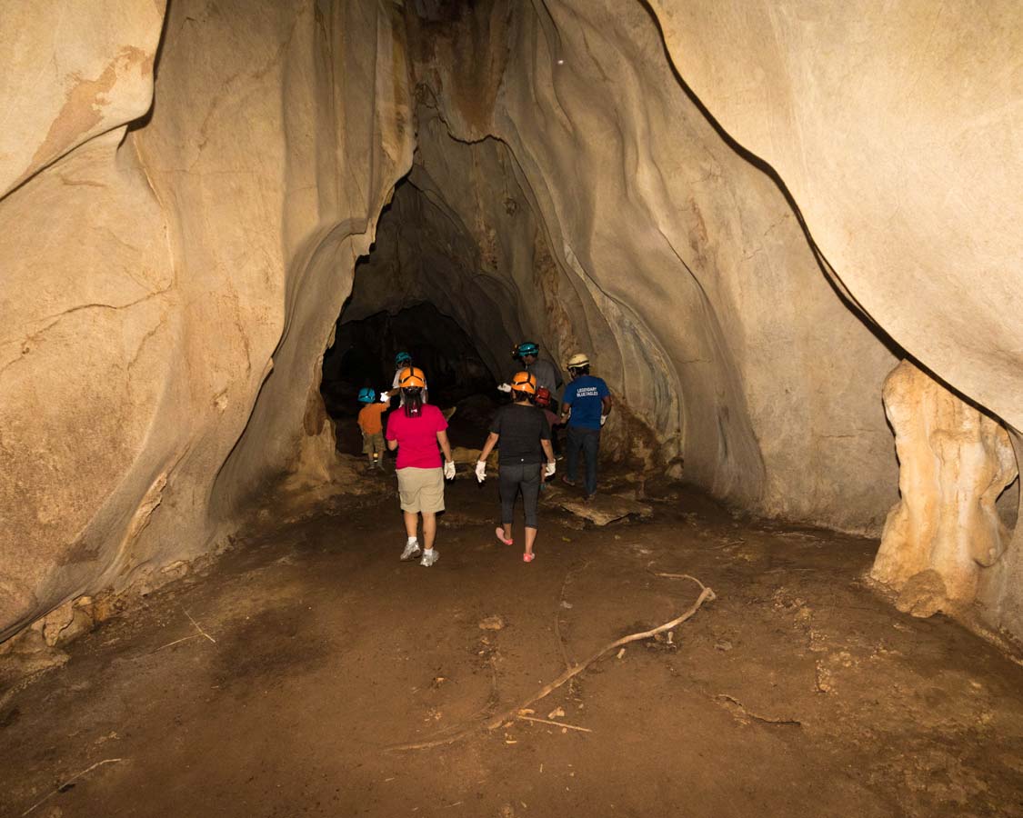 Group walks through Hundred Caves in Puerto Princesa Philippines