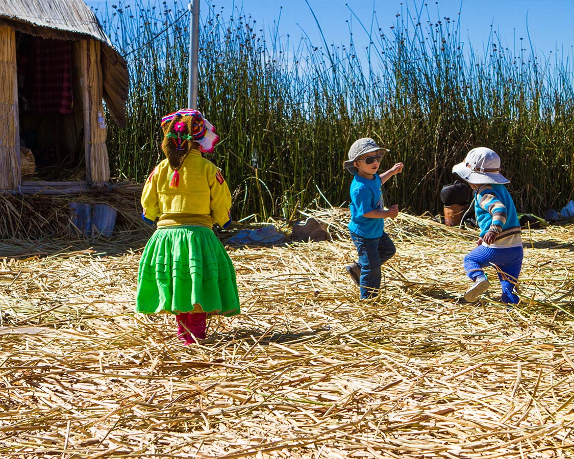 Children playing on Lake Titicaca Isla de los Uros