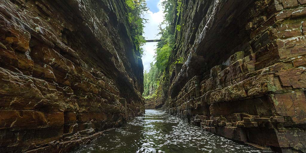 Thinking of visiting Ausable Chasm New York, the Grand Canyon of the Adirondacks? Discover how to get there and the best things to do at Ausable Chasm NY