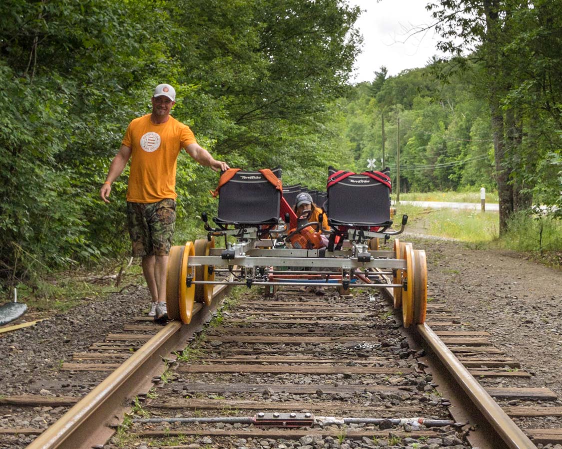 Revolution Rail Co staff shuffling Rail Bike