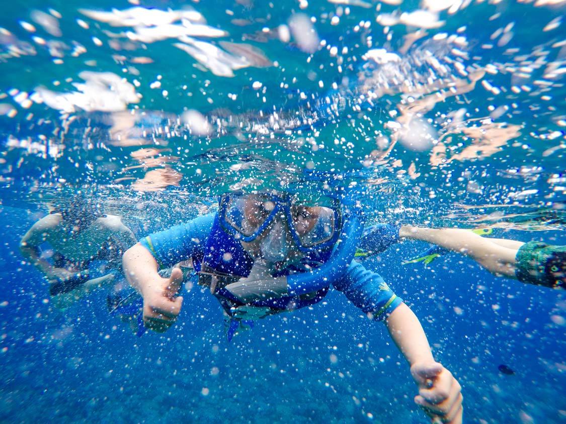 Young Boy learning to snorkel in Maui Hawaii