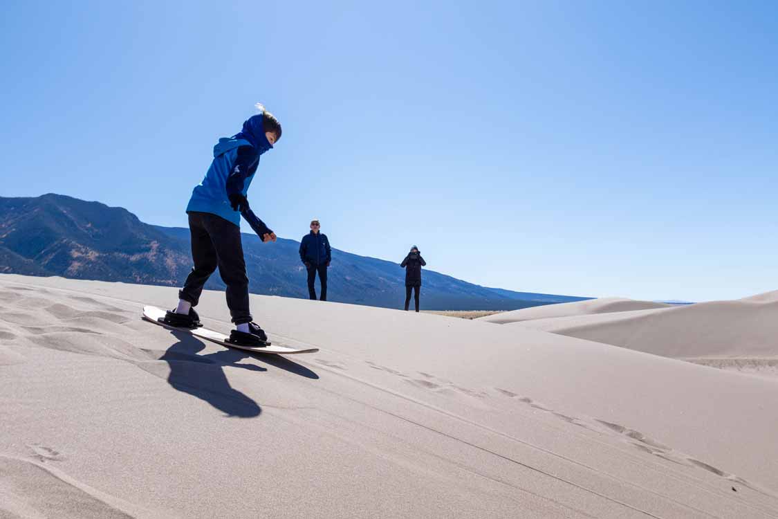 Sandboarding in Great Sand Dunes National Park with kids