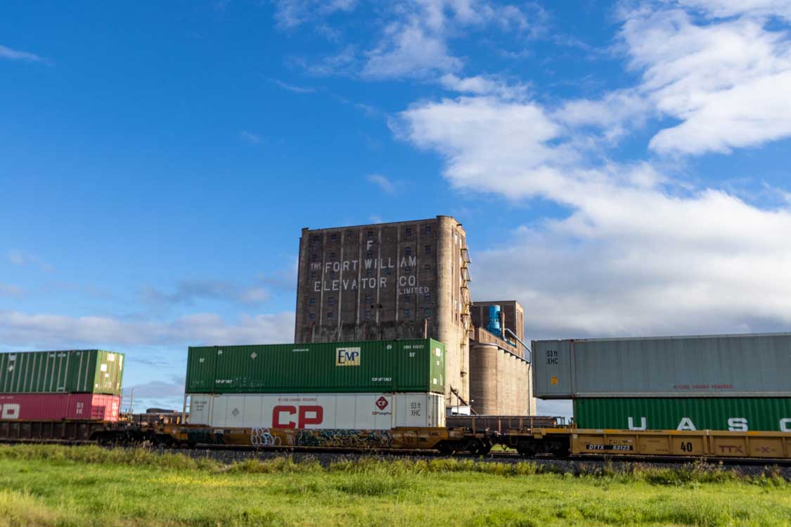 A Train in Front of a Grain Elevator in Thunder Bay Ontario