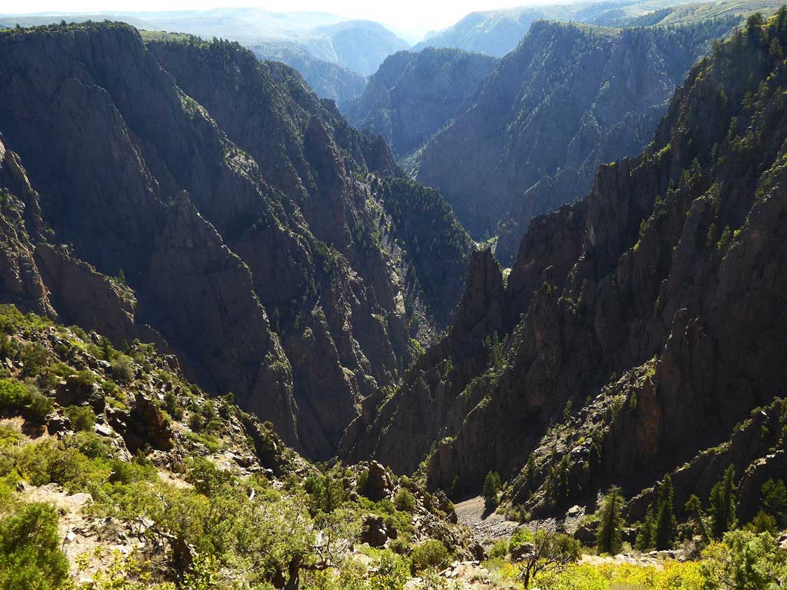 Large canyon with steep cliffs and jagged rocks