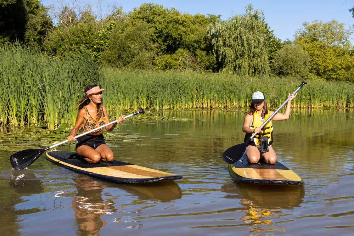 Christina paddling with Indigenous paddleboard operator Oceah Oceah in Toronto