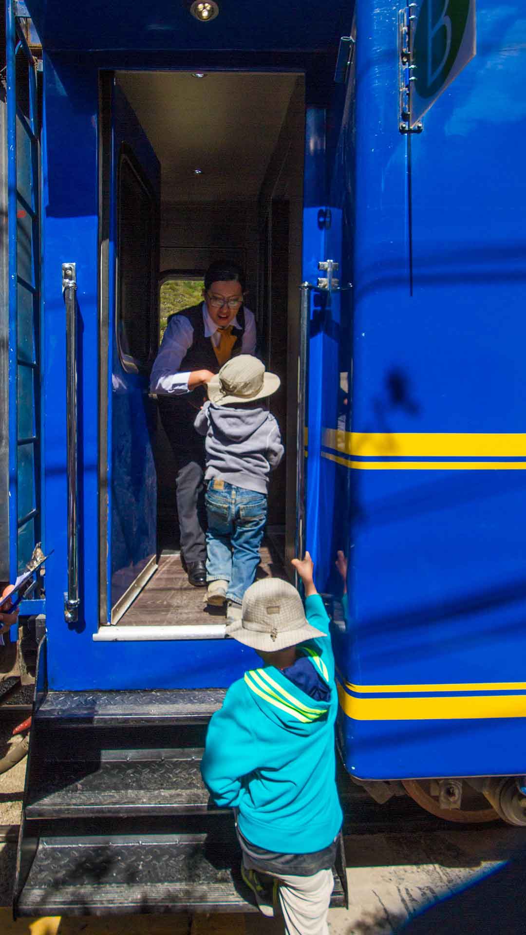 Children boarding the train to Machu Picchu