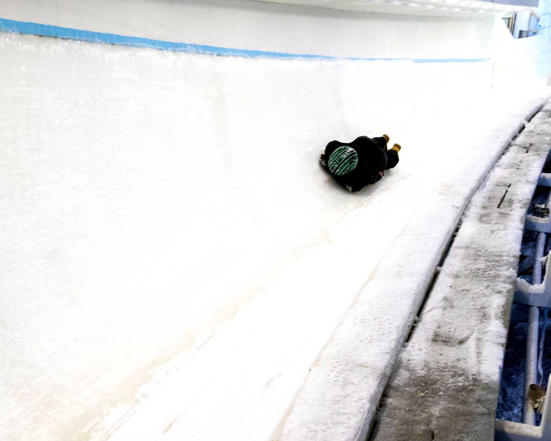 A skeleton athlete practices at the Lake Placid boblsed center