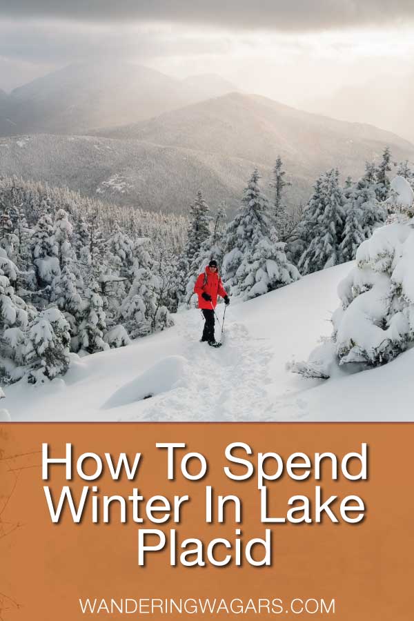 Woman in a red jacket snowshoeing among tree's in the Adirondack Mountains