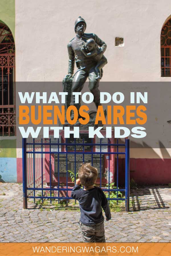 Two boys looking at a statue in La Boca Buenos Aires