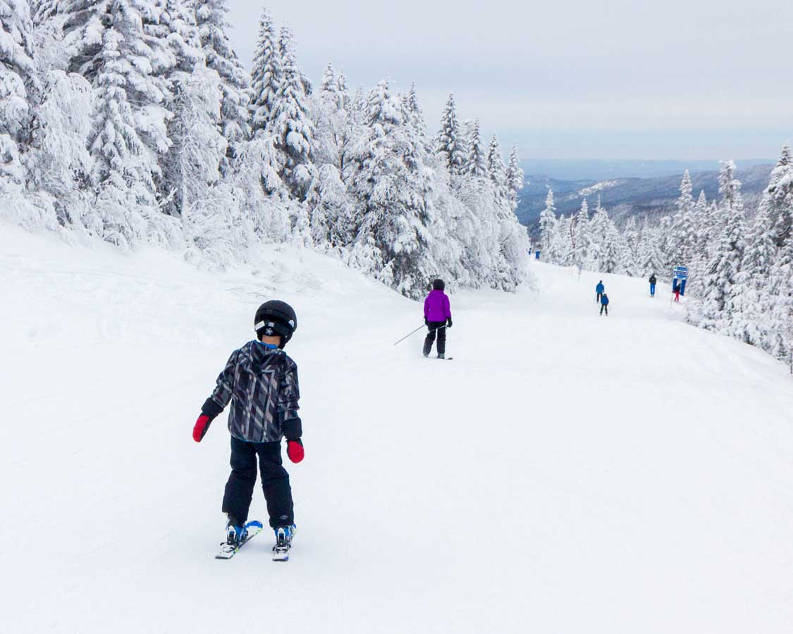 Boy skiing fresh powder in the Catskills of Upstate New York