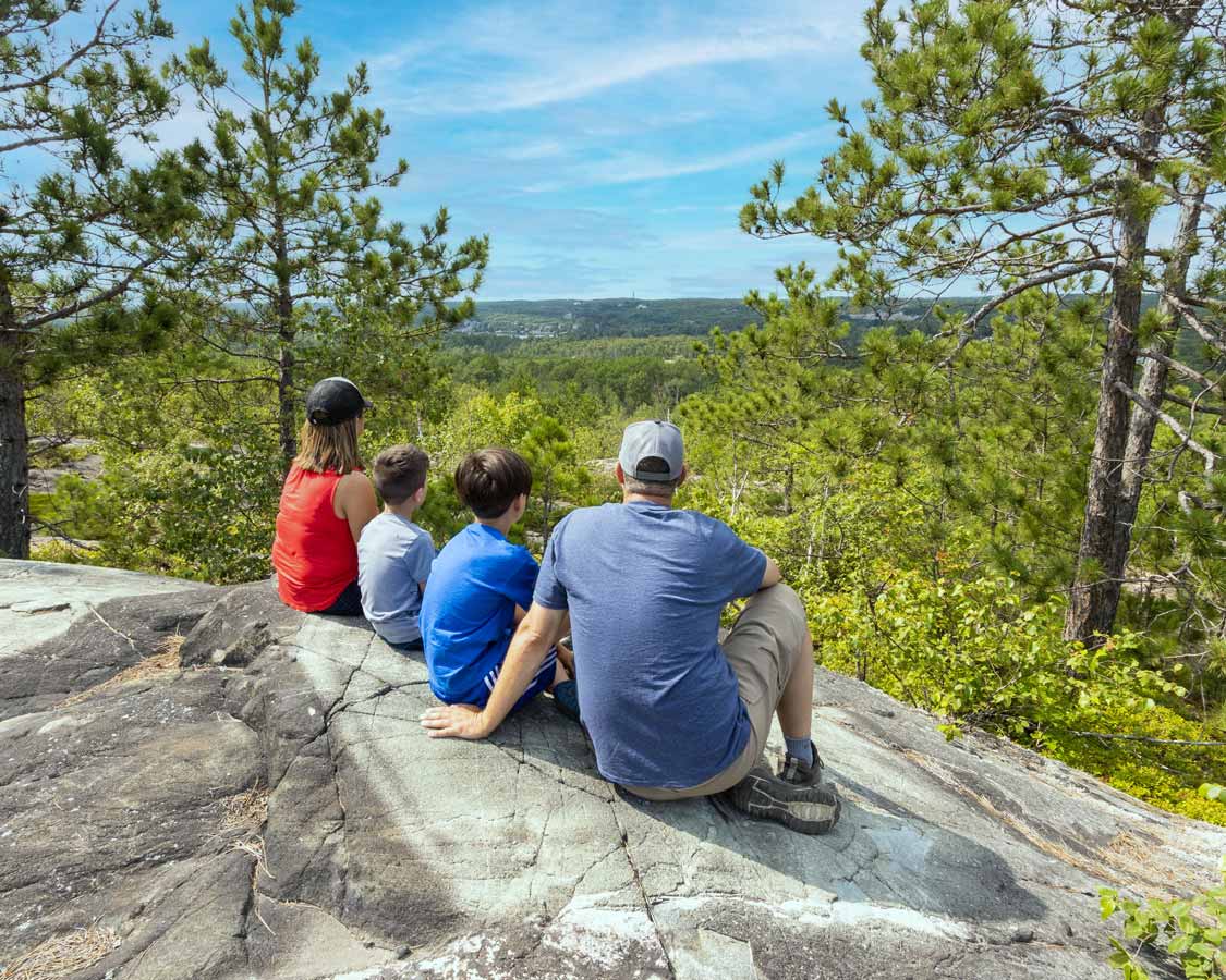 family hiking in Sudbury's Kivi Park