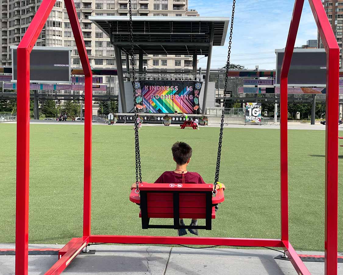 Boy on a swing at Celebration Square Mississauga