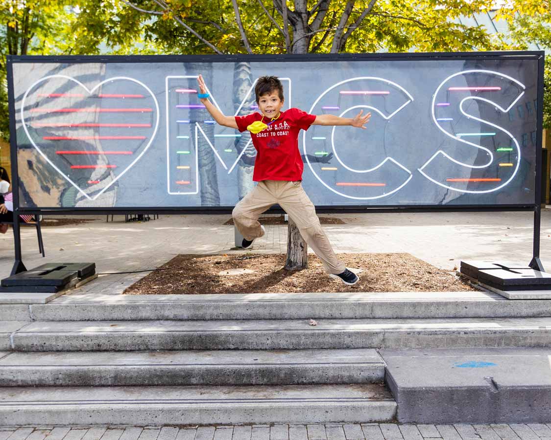 Boy jumping at Celebration Square in Mississauga