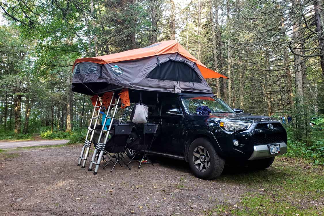 SUV with a rooftop tent overlanding at Neys Provincial Park