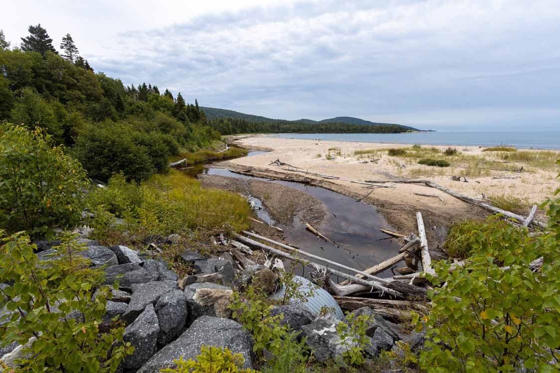Driftwood strewn beach at Neys Provincial Park campground