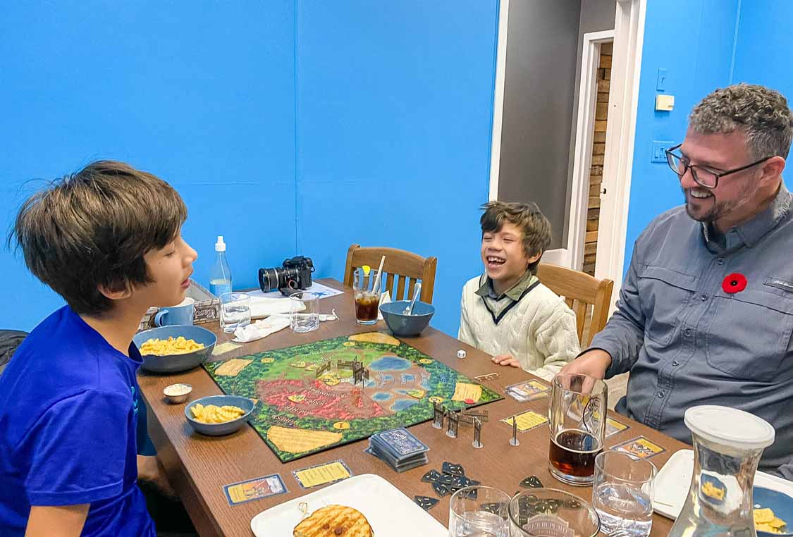 A family having fun at the Boardwalk Lounge on a Peterborough weekend itinerary