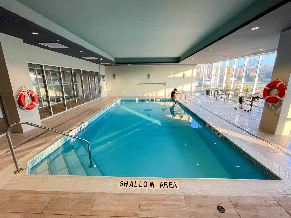 A boy swims in the pool at Hampton Inn Peterborough