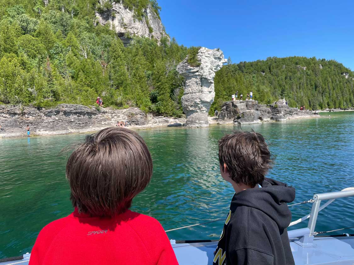 Boys looking at Flowerpot Island in Fathom Five National Park