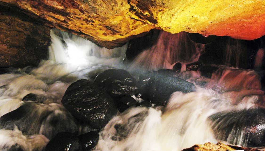 Noisy Cave waterfall at Natural Stone Bridge and Caves in New York
