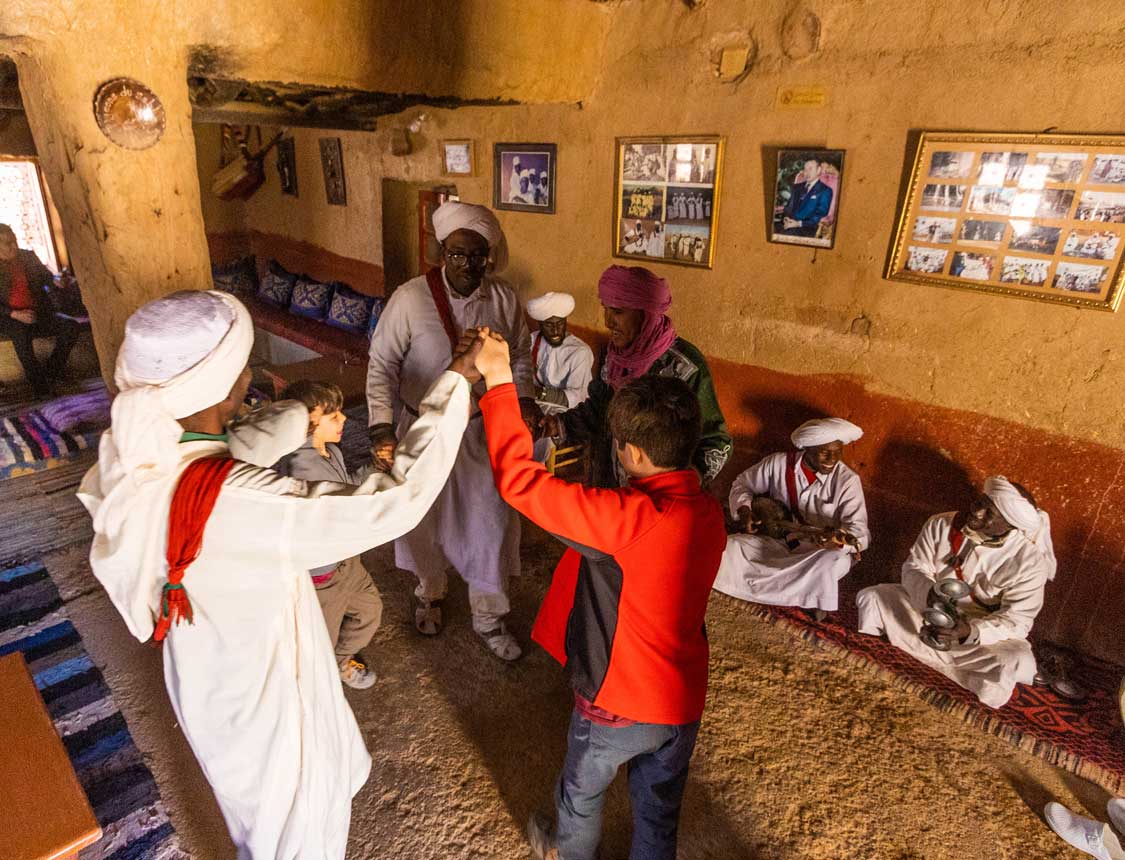 Children dancing to Berber music in Merzouga, Morocco