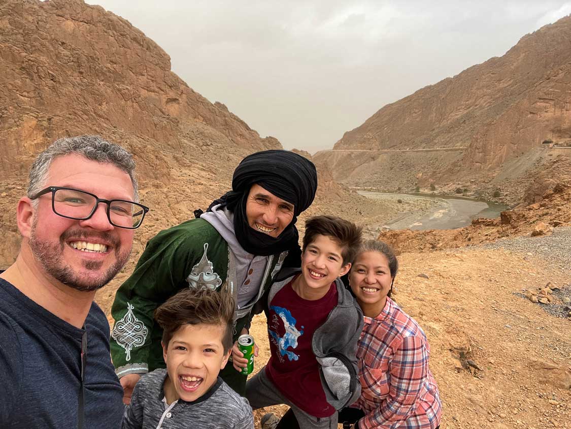 A family with their Berber guide at Ziz Gorge, Morocco