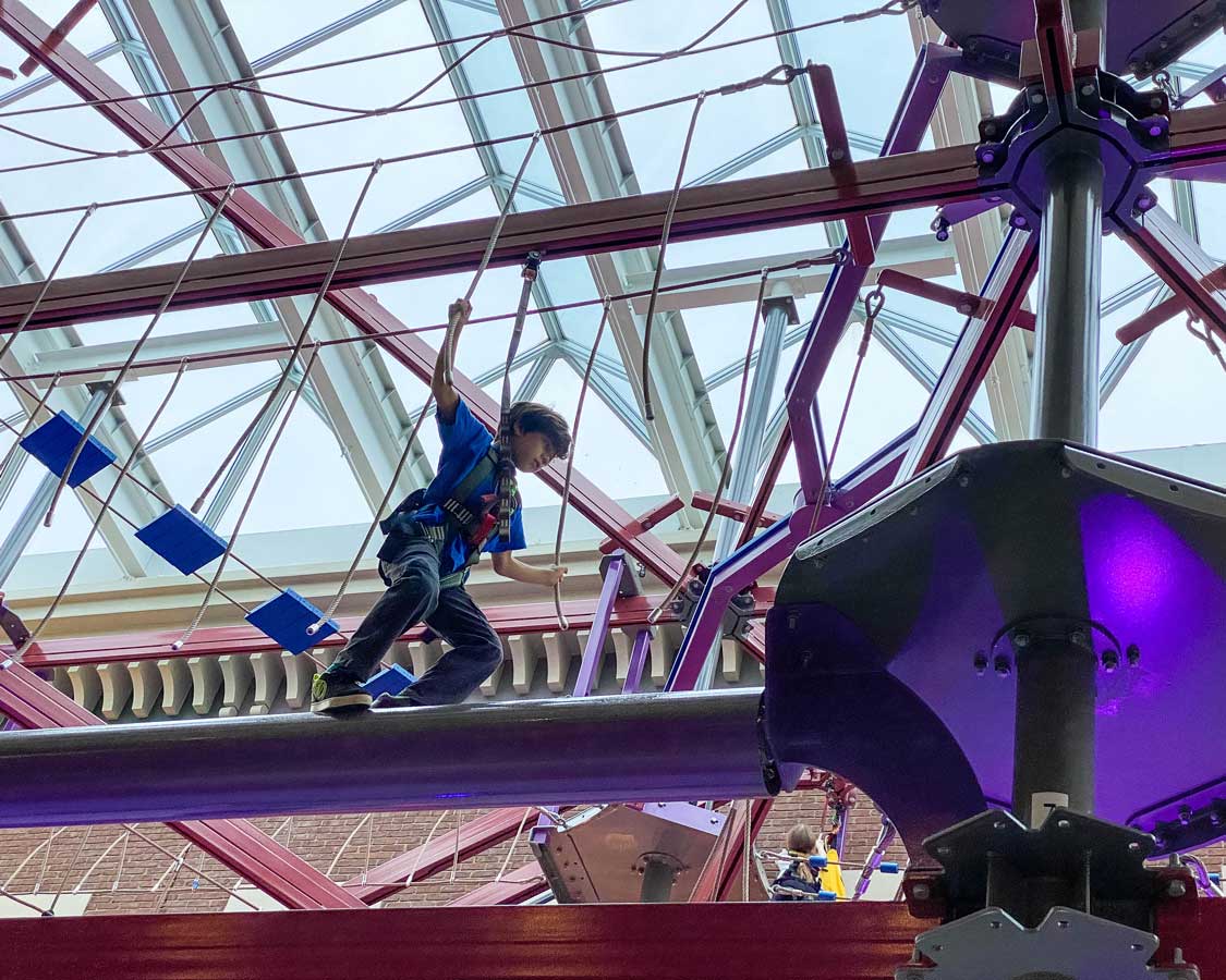 Child on the Strong Museum of Play Sky Climb