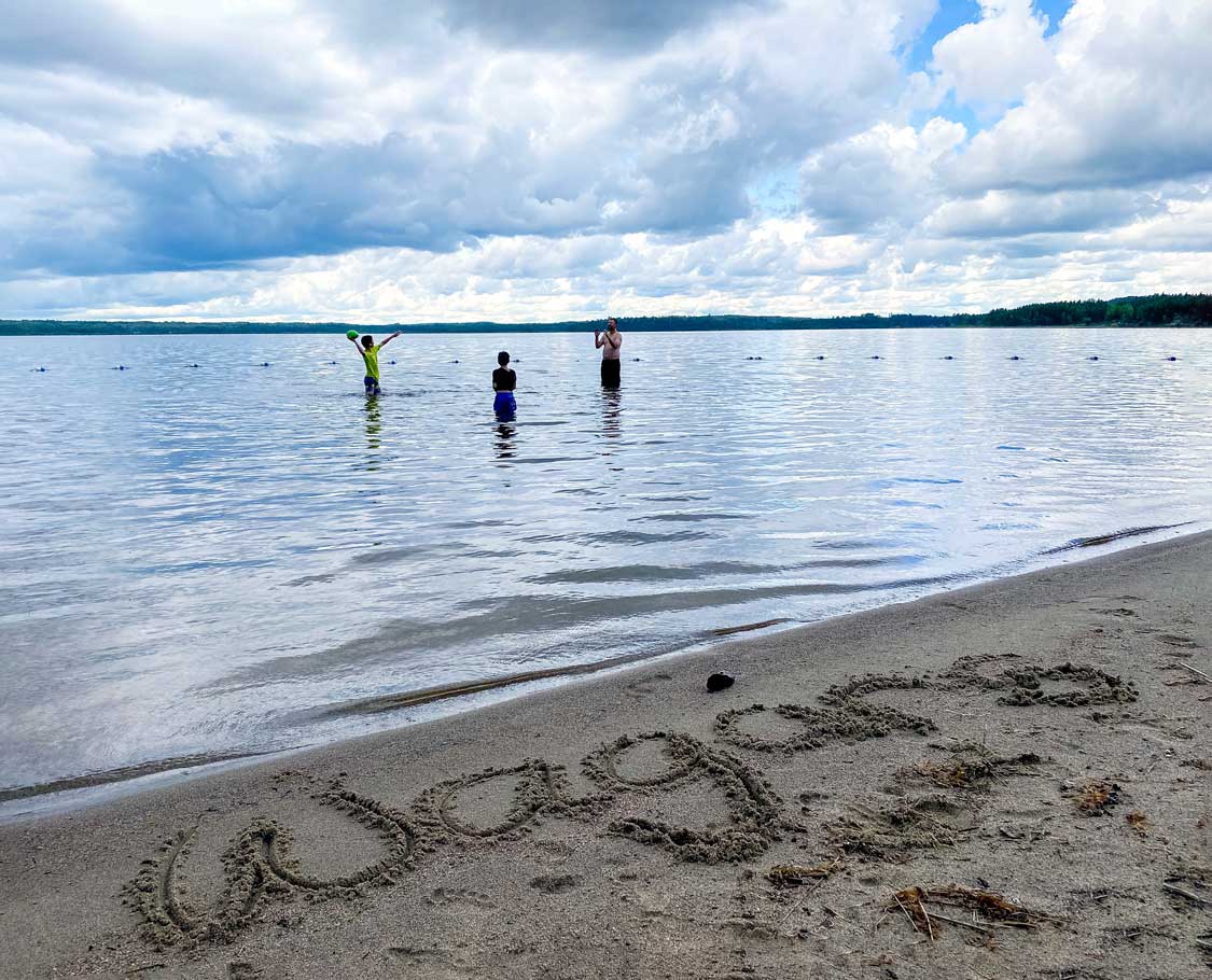 Family playing at Ivanhoe Lake beach