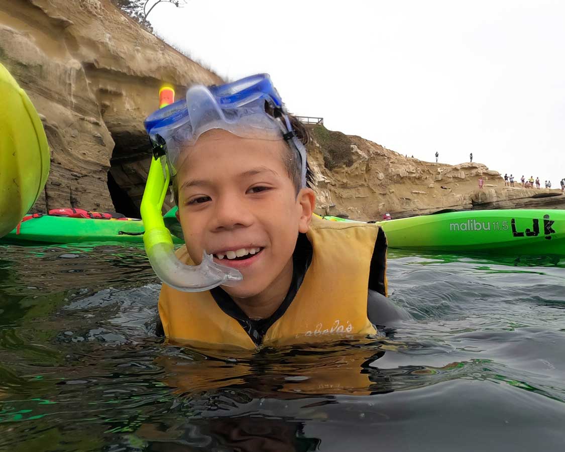 Boy snorkeling in La Jolla, California