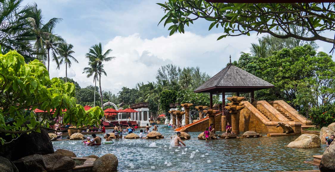 Families spash in the water of the Andamanda Water Park in Phuket