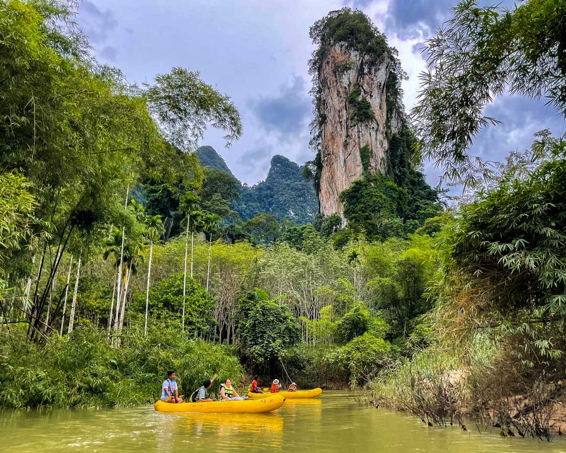 Kayaks float down a river in Khao Sok National Park