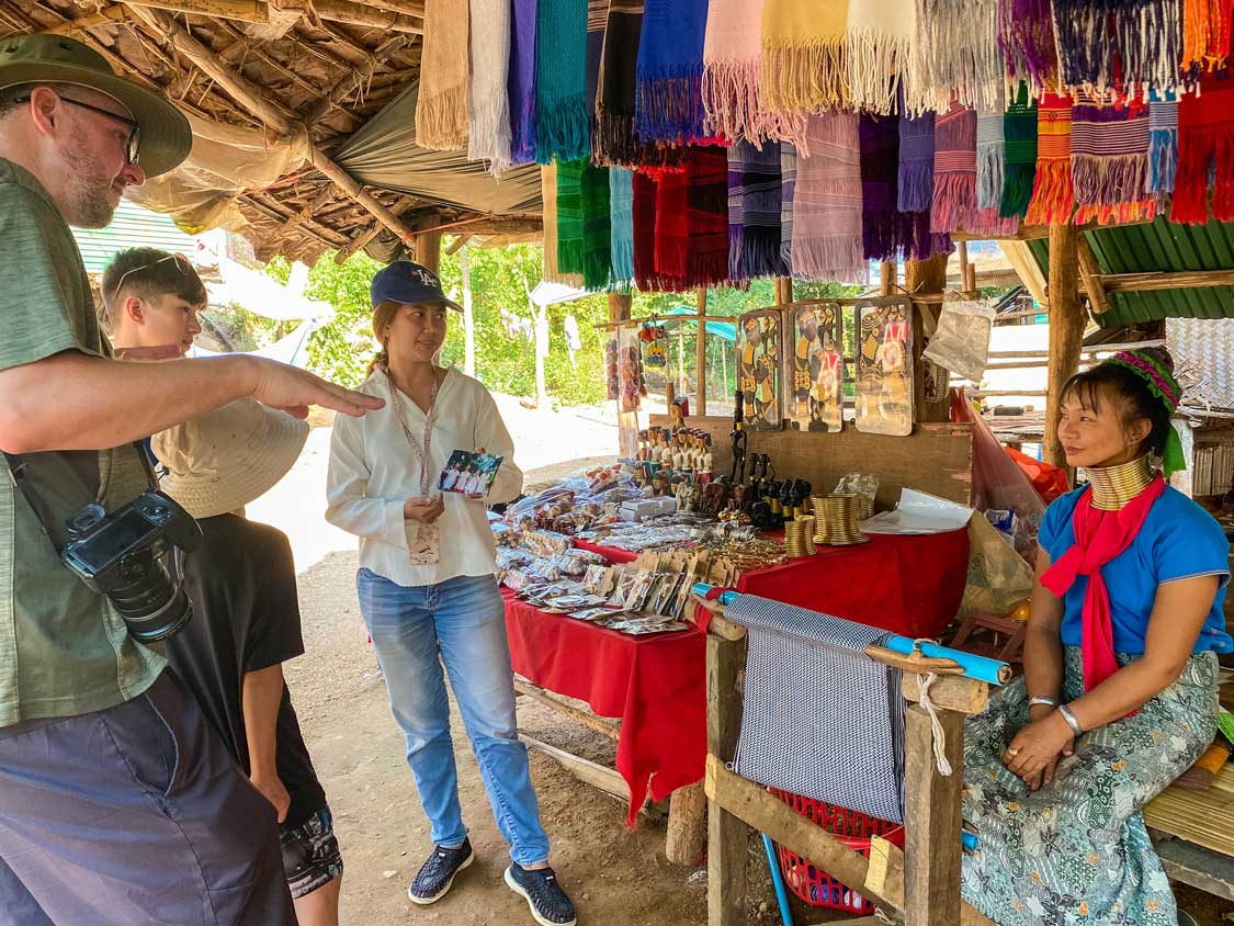 Kevin Wagar speaking with a member of the long neck Karen tribe in Thailand