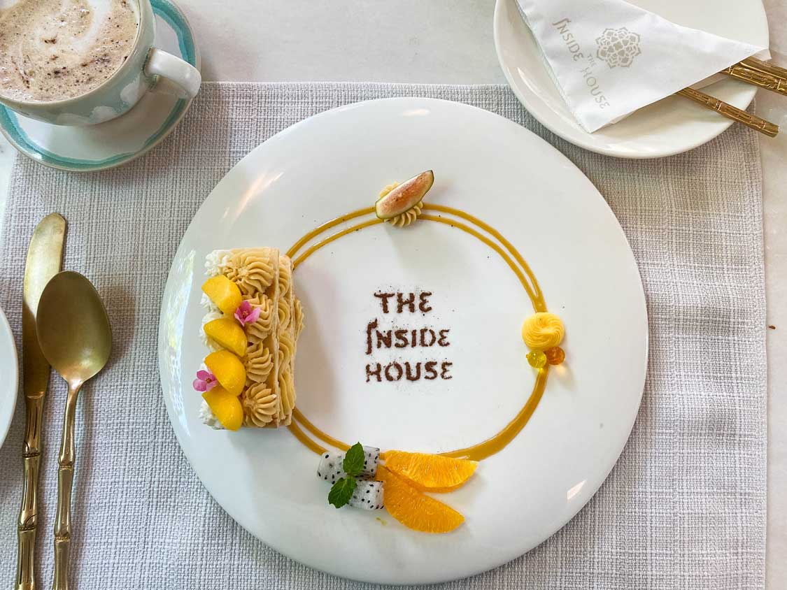 An ornately decorated plate with delicious looking treats at the Inside House restaurant