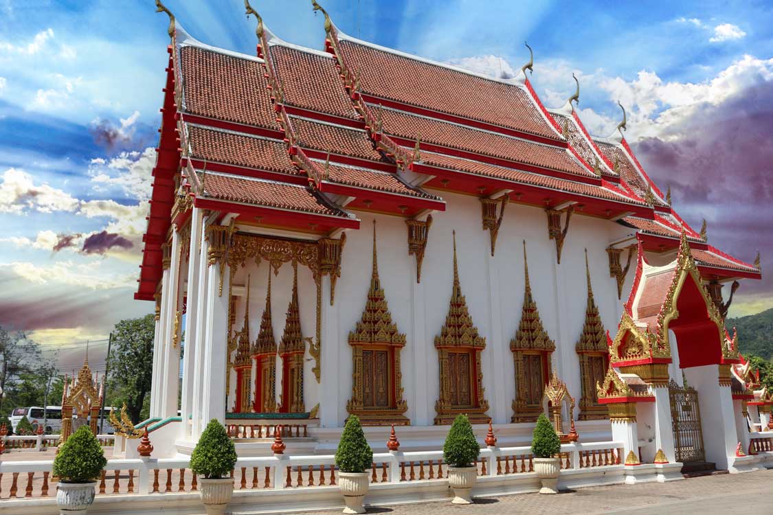 Wat Chalong Temple in Phuket, Thailand against a late day sky