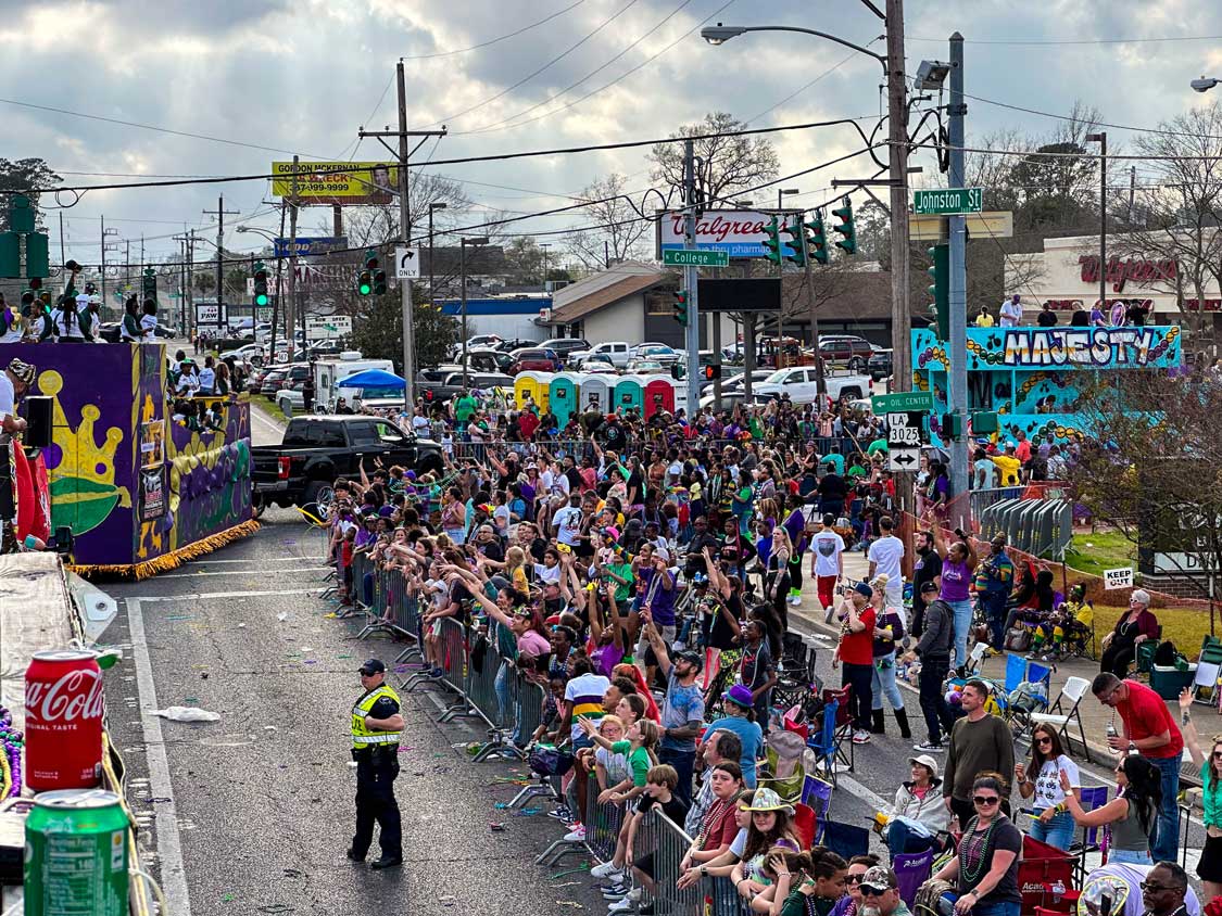 Crowds watch floats go by during Mardi Gras in Lafayette, Louisiana