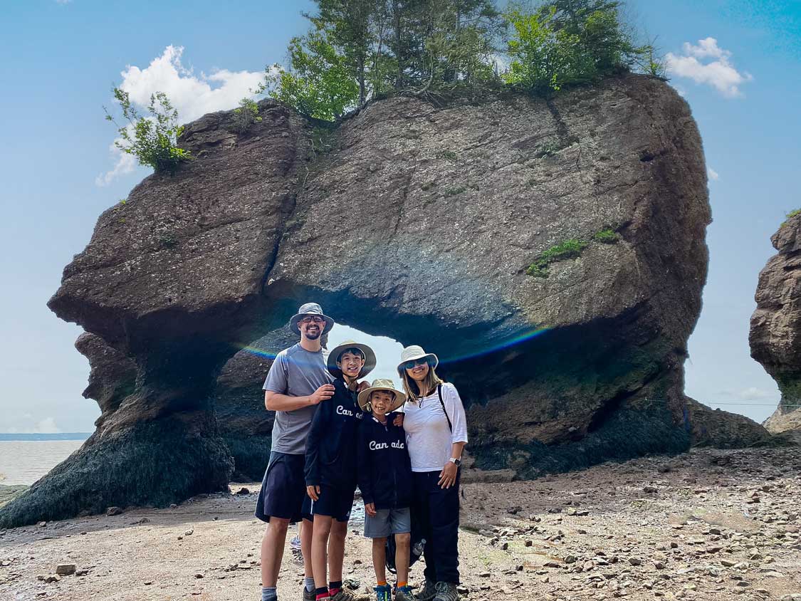 The Wandering Wagars family standing at Hopewell Rock New Brunswick