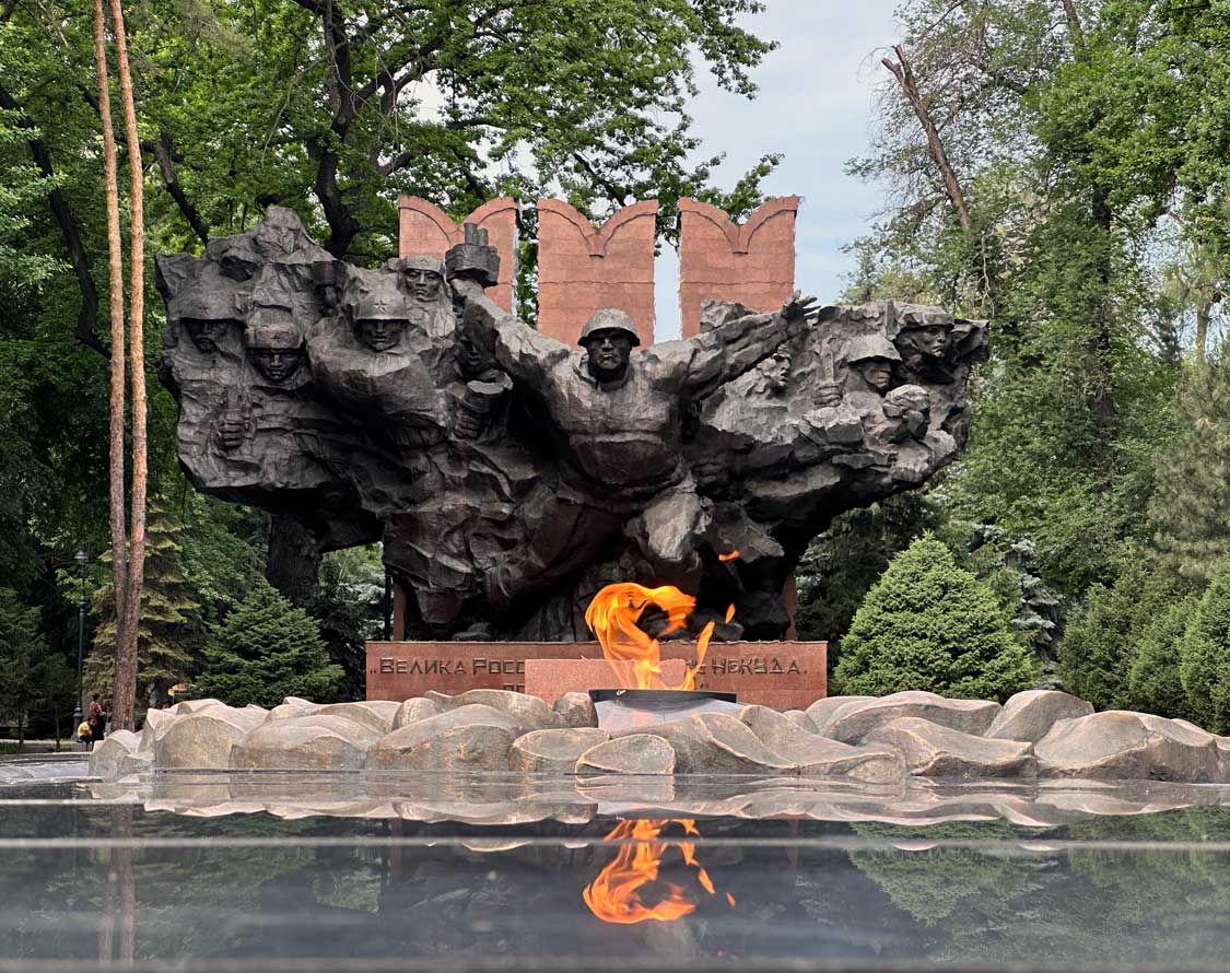 A Soviet-era war memorial in front of an eternal flame in Panifilov Park in central Almaty, Kazakhstan